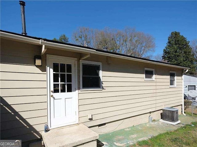 exterior space featuring central AC unit and crawl space