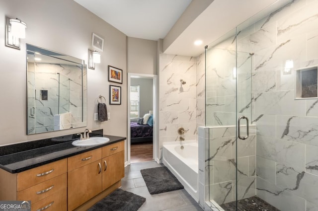 ensuite bathroom featuring a garden tub, vanity, visible vents, a marble finish shower, and ensuite bath