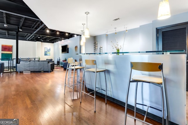 kitchen featuring visible vents and wood finished floors