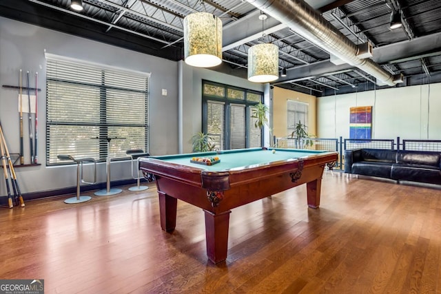 recreation room featuring billiards, wood finished floors, and baseboards