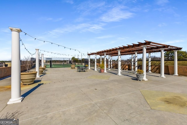 view of community with fence and a pergola