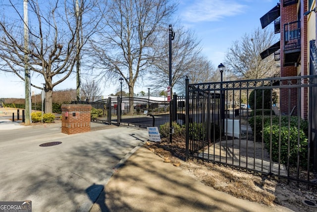 view of gate with fence