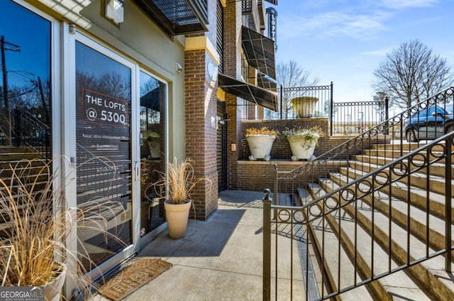 view of patio featuring stairway