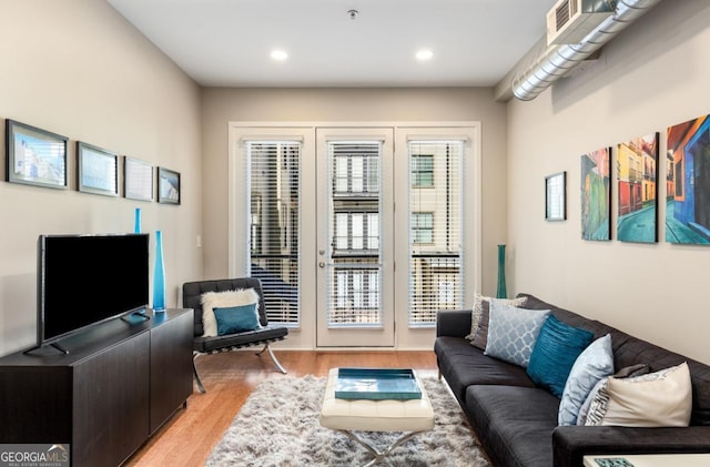 living room featuring recessed lighting and light wood-style floors