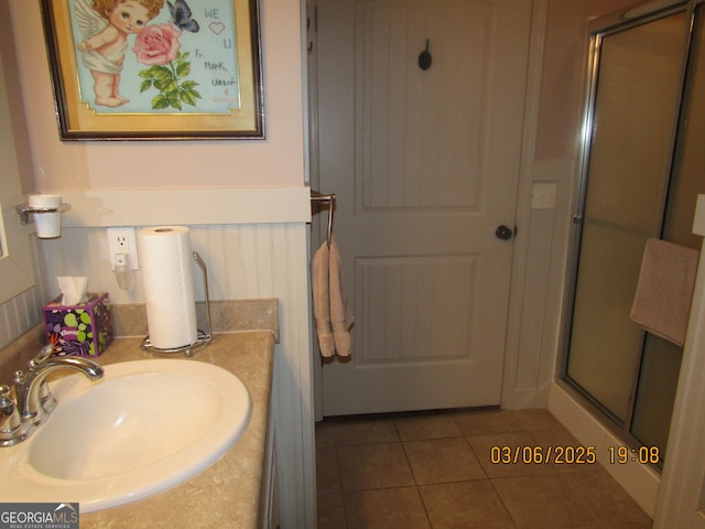 full bathroom featuring a shower stall, vanity, and tile patterned floors