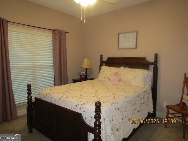 bedroom with carpet flooring and baseboards