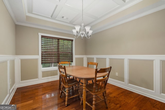 dining area featuring a chandelier, hardwood / wood-style floors, wainscoting, and a decorative wall