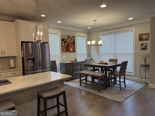dining space featuring a notable chandelier, visible vents, and recessed lighting