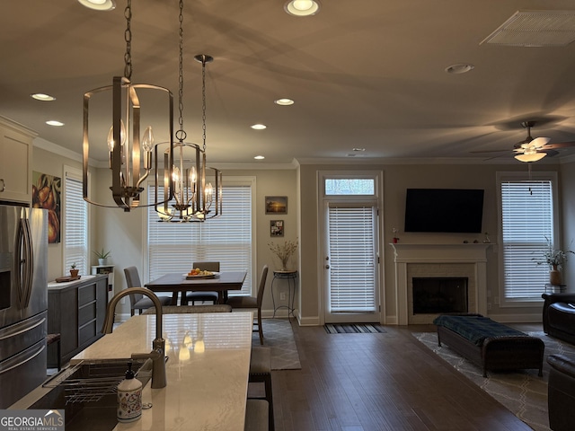dining space featuring baseboards, ornamental molding, and recessed lighting