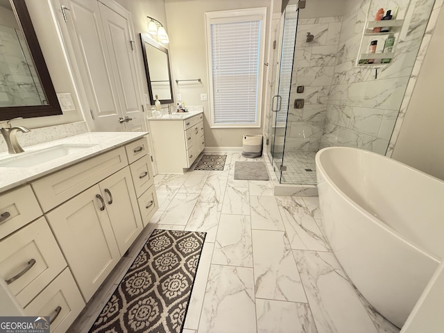 full bathroom featuring baseboards, marble finish floor, a sink, a shower stall, and a freestanding bath