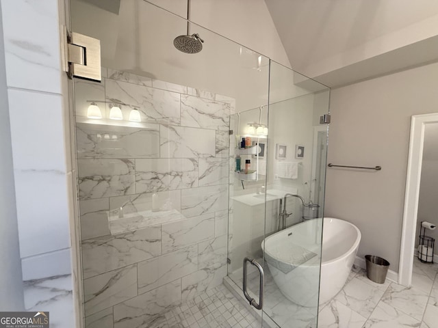 full bath featuring a tile shower, marble finish floor, a soaking tub, and vaulted ceiling