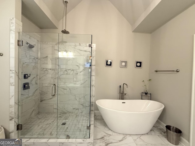 full bath with a marble finish shower, a soaking tub, baseboards, marble finish floor, and lofted ceiling