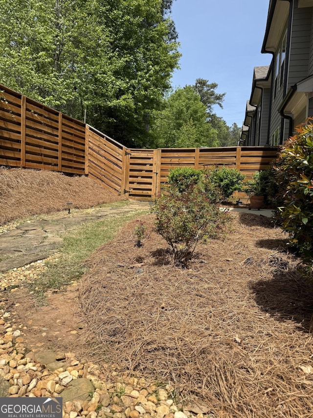 view of yard featuring a fenced backyard