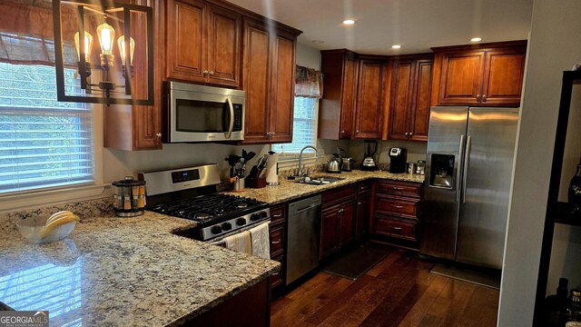 5142 Rock Eagle Dr, Stone Mountain, GA 30083 - kitchen featuring stainless steel appliances, a sink, dark wood-style flooring, light stone countertops, and recessed lighting