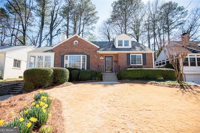 new england style home with brick siding