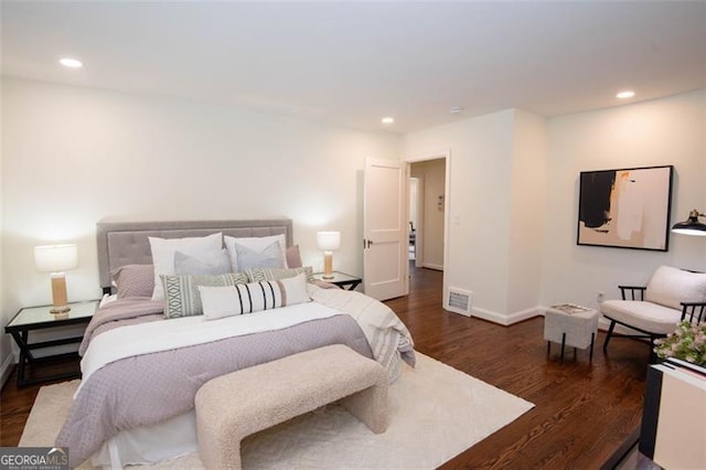 bedroom with baseboards, visible vents, dark wood-style flooring, and recessed lighting