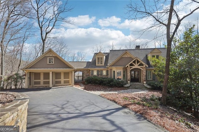 view of front facade with driveway and an attached garage