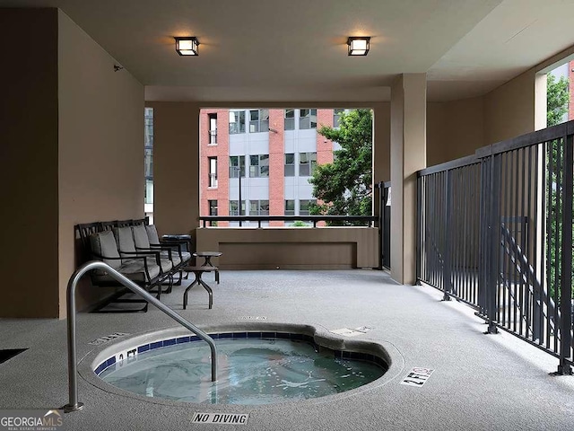 view of pool featuring an indoor hot tub