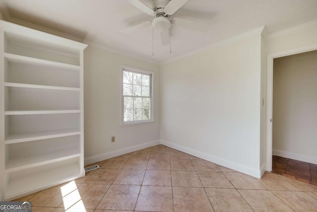 empty room with ceiling fan, baseboards, crown molding, and tile patterned floors