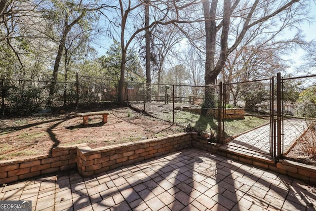 view of patio / terrace featuring fence