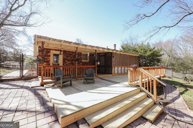 wooden deck with a gate and fence