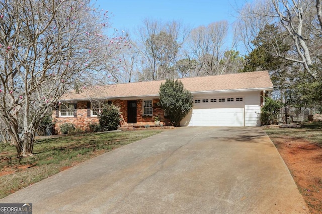 ranch-style home featuring driveway and an attached garage