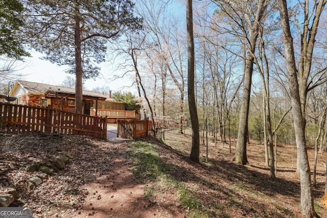 view of yard with a wooden deck