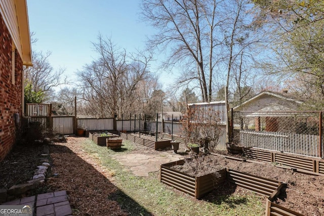 view of yard featuring a garden and fence