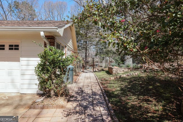 view of property exterior featuring fence