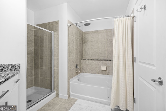 bathroom with vanity, tile patterned floors, and tiled shower / bath combo