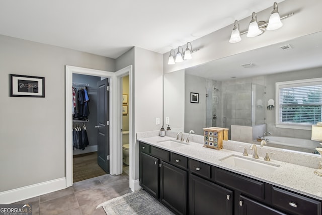 full bathroom featuring tile patterned floors, a sink, visible vents, and a shower stall