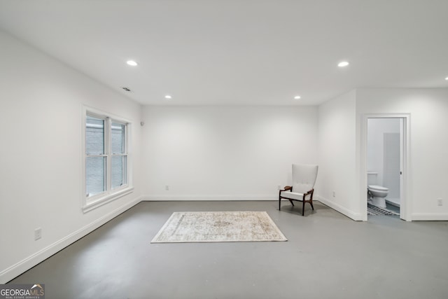 unfurnished room featuring recessed lighting, visible vents, finished concrete flooring, and baseboards