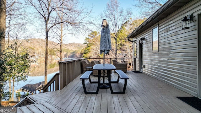 wooden deck with outdoor dining space