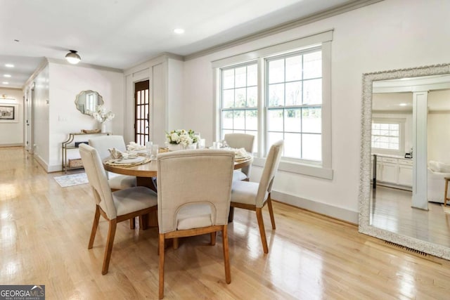 dining space featuring recessed lighting, visible vents, baseboards, ornamental molding, and light wood finished floors