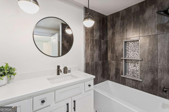 bathroom featuring shower / bathing tub combination and vanity