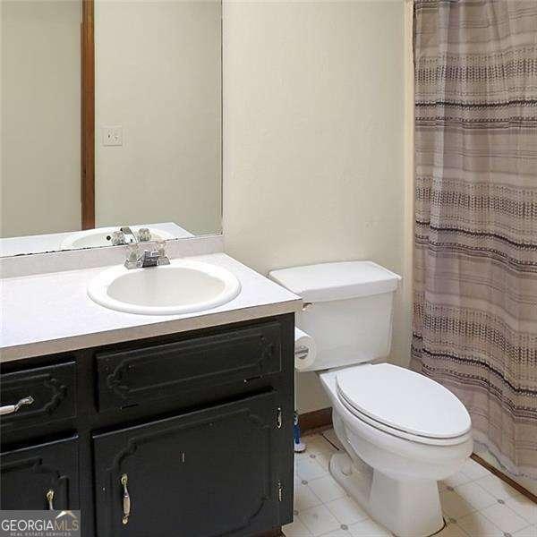 spare room with visible vents, baseboards, and a textured ceiling