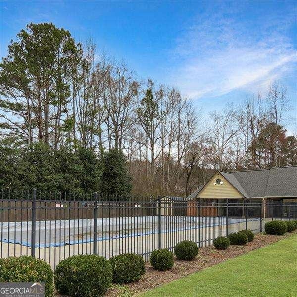 view of swimming pool with fence