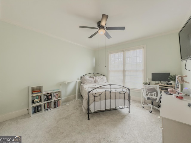 bedroom featuring carpet flooring, baseboards, and crown molding