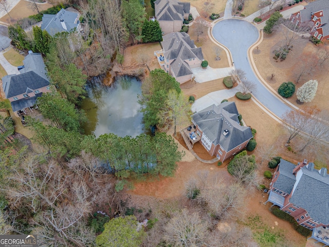 birds eye view of property with a residential view and a water view