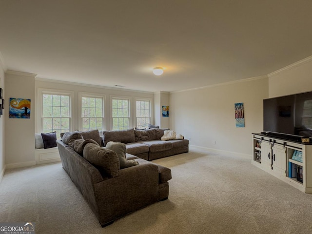 carpeted living area with plenty of natural light, baseboards, and ornamental molding