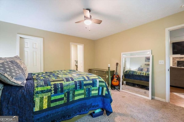 carpeted bedroom with baseboards and a ceiling fan