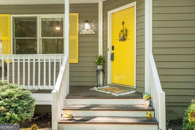 entrance to property featuring a porch