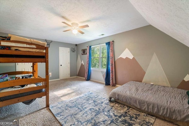 bedroom featuring baseboards, visible vents, a ceiling fan, a textured ceiling, and carpet flooring