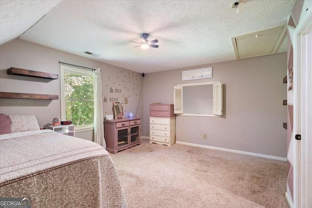 bedroom featuring attic access, baseboards, visible vents, carpet, and a textured ceiling