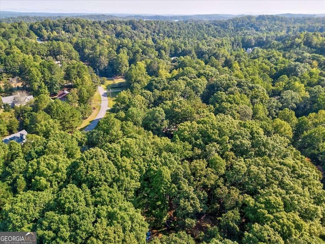 drone / aerial view with a view of trees