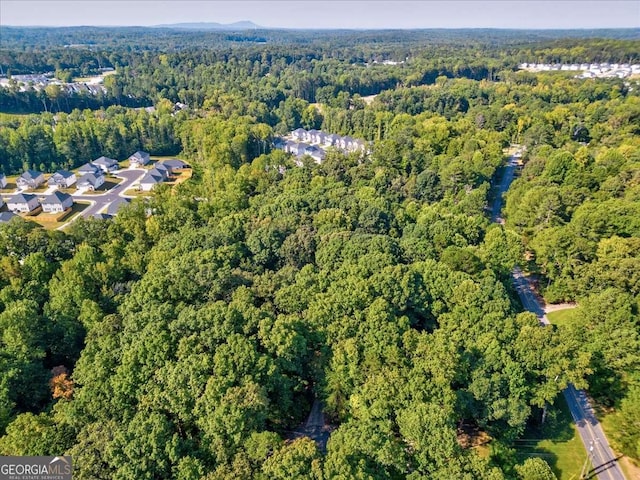 bird's eye view featuring a forest view