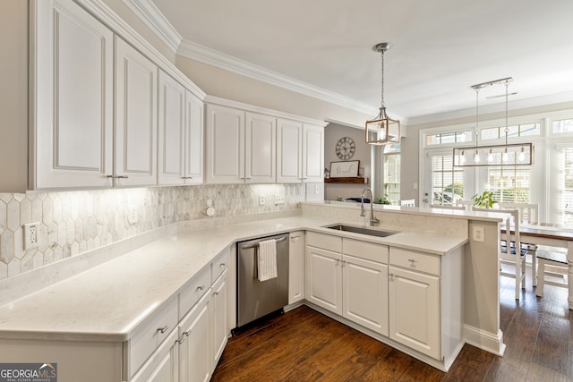 kitchen with dark wood-type flooring, dishwasher, ornamental molding, a peninsula, and a sink