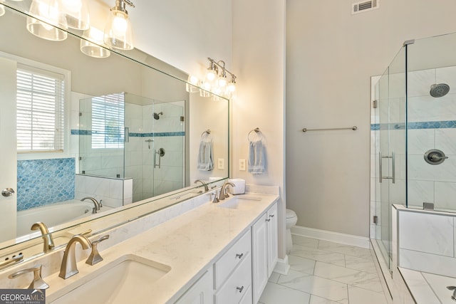 full bath featuring a stall shower, visible vents, marble finish floor, and a sink