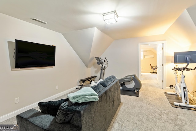 workout room featuring vaulted ceiling, visible vents, baseboards, and carpet floors