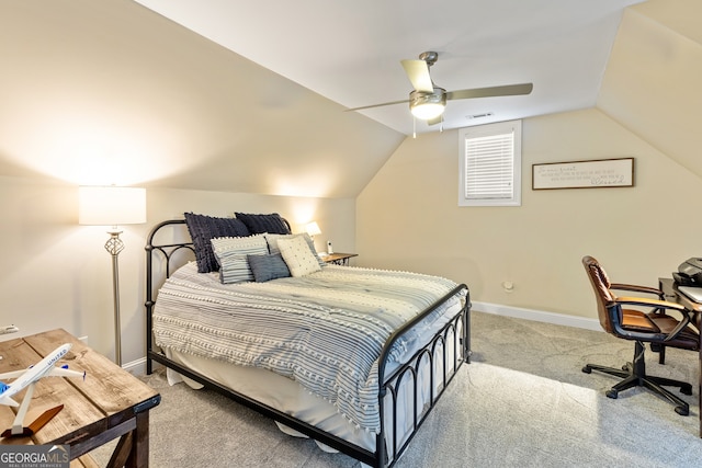 carpeted bedroom with baseboards, lofted ceiling, and a ceiling fan